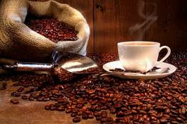 Obraz na płótnie filiżanka kawy z ziarnami kawy