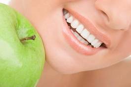 Obraz na płótnie zdrowe zęby i zielone jabłko
