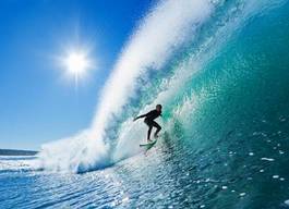 Naklejka surfowanie na błękitnych falach oceanu
