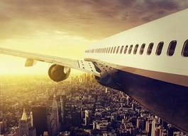 Obraz na płótnie samolot nad metropolią