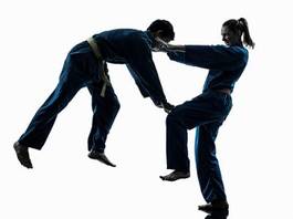 Obraz na płótnie dziewczynka sztuki walki ćwiczenie azjatycki mężczyzna