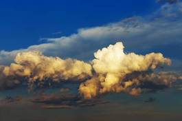 Naklejka fluffy clouds at sunset