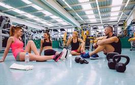 Fotoroleta friends talking on fitness center after training day