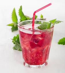 Obraz na płótnie summer cold drink with raspberries, ice and mint .