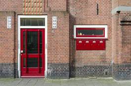 Fotoroleta door and mailbox outside apartment building in amsterdam