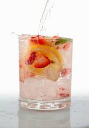 Fotoroleta seltzer drink with fresh cut fruit floating inside