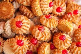 Naklejka cookies with red fruit jelly as a background for design