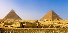 Obraz na płótnie pejzaż słońce statua piramida niebo