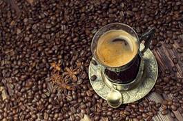 Fotoroleta coffee cup on coffee grains background