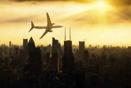 Fototapeta samolot nad miastem