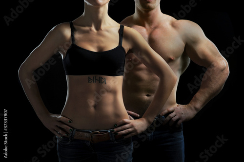 Fotoroleta Kobieta i mężczyzna w siłowni