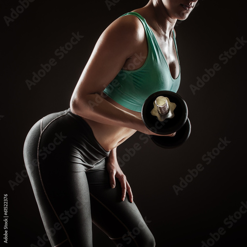 Plakat Kobieta ćwicząca z hantlem