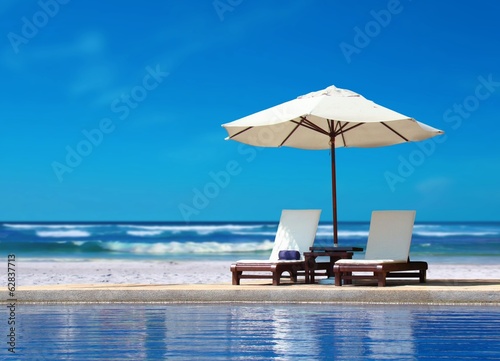 Obraz na płótnie plaża niebo leżak brzeg lato