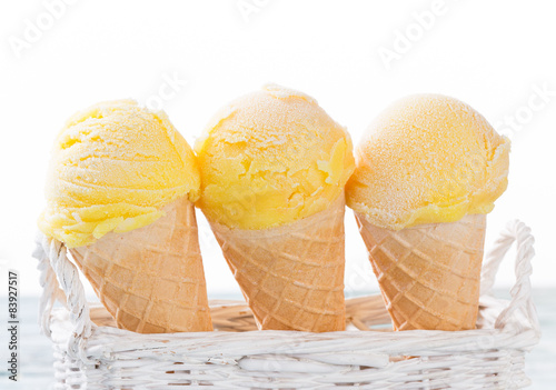 Fotoroleta Ice cream scoops on wooden table.