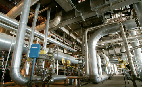 Fototapeta Industrial zone, Steel pipelines, valves and pumps