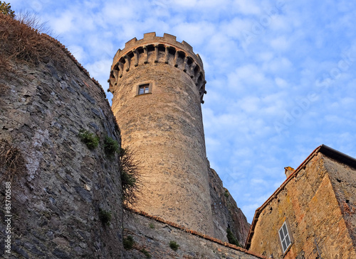 Naklejka Tower of castello Odeschalchi in Bracciano with blue sky and fluffy clouds, Rome, Lazio, Italy, Europe
