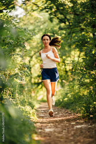 Obraz na płótnie woman running in the park